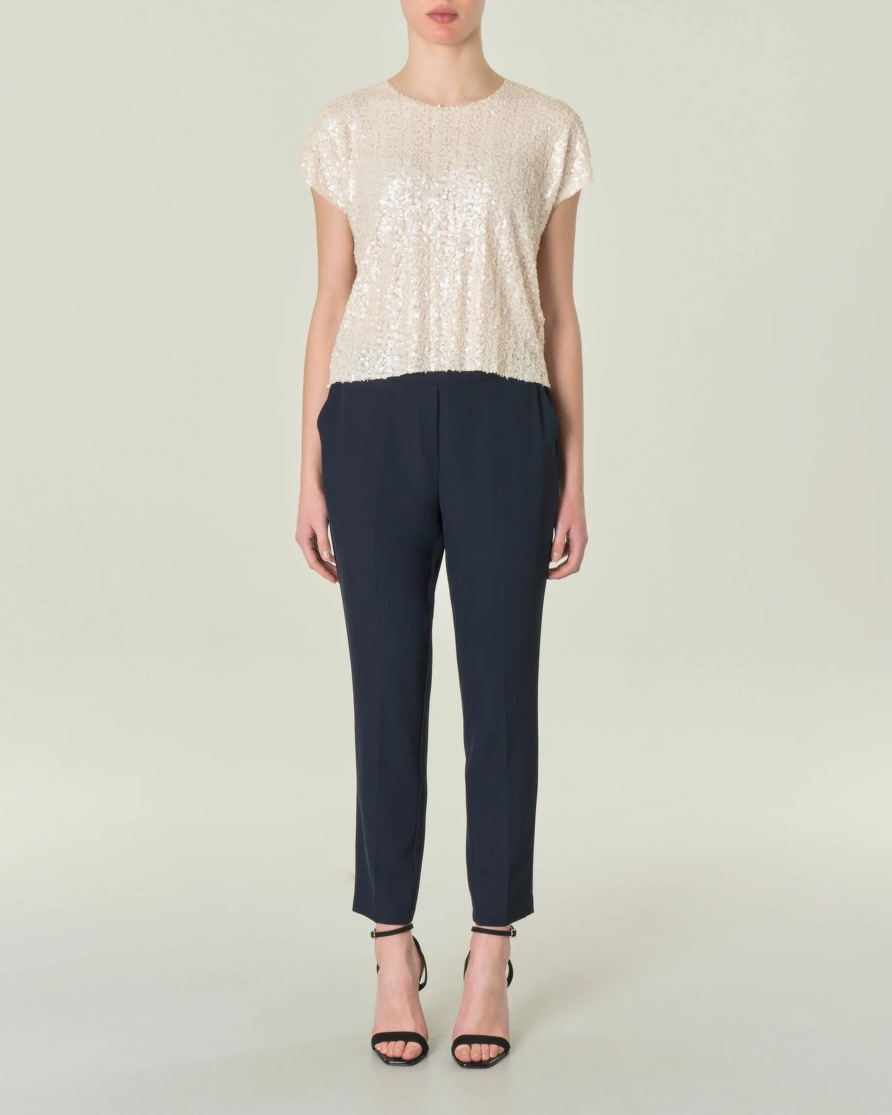 Pantaloni blu in tessuto tecnico stretch con elastico inserito in vita
